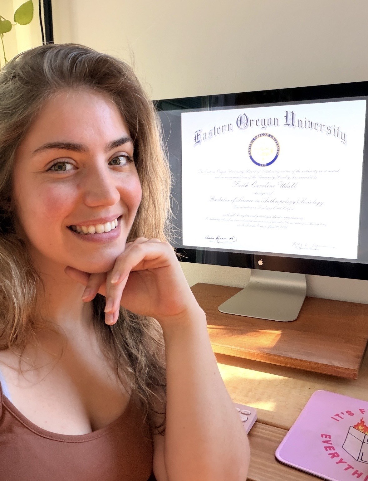 Faith with her Bachelor of Science from Eastern Oregon University